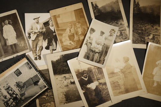 Grouping of 10+ Antique and Vintage Snapshot Photographs including Girl Sitting on Rocks, Parlor Interior, and Family Portraits