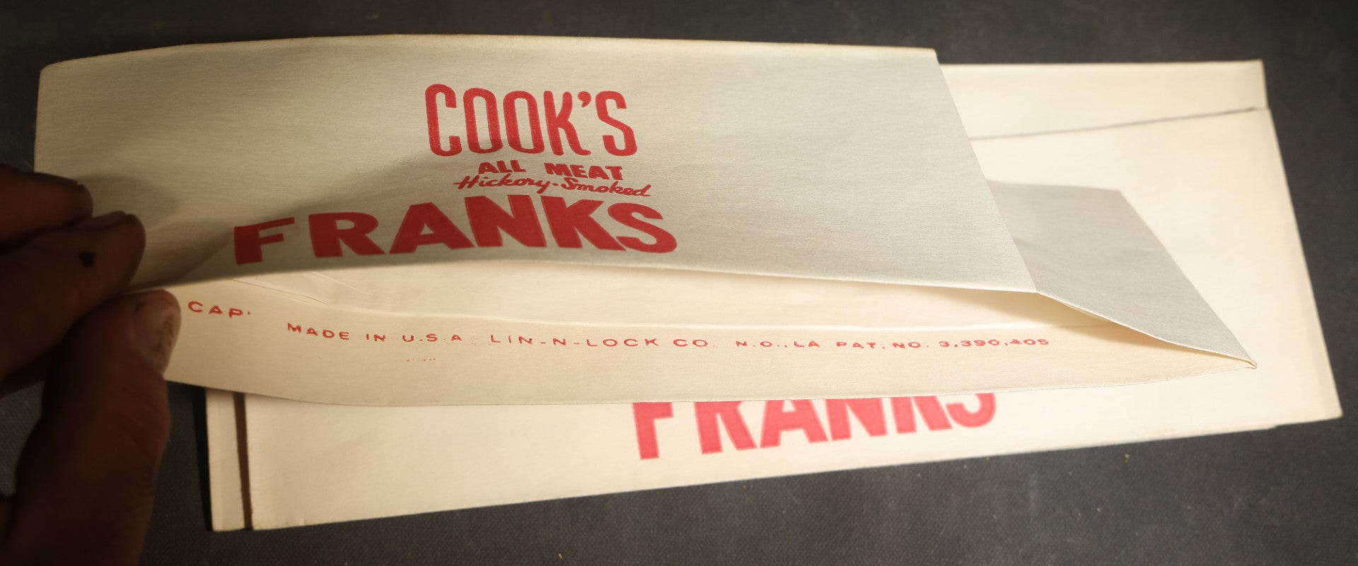 Grouping of Six Vintage Advertising Ephemera Pieces including Four Cook's All Meat Hickory-Smoked Franks Hats, Cafes Popeye Bag, and Red Devil Carboloy Blade Package