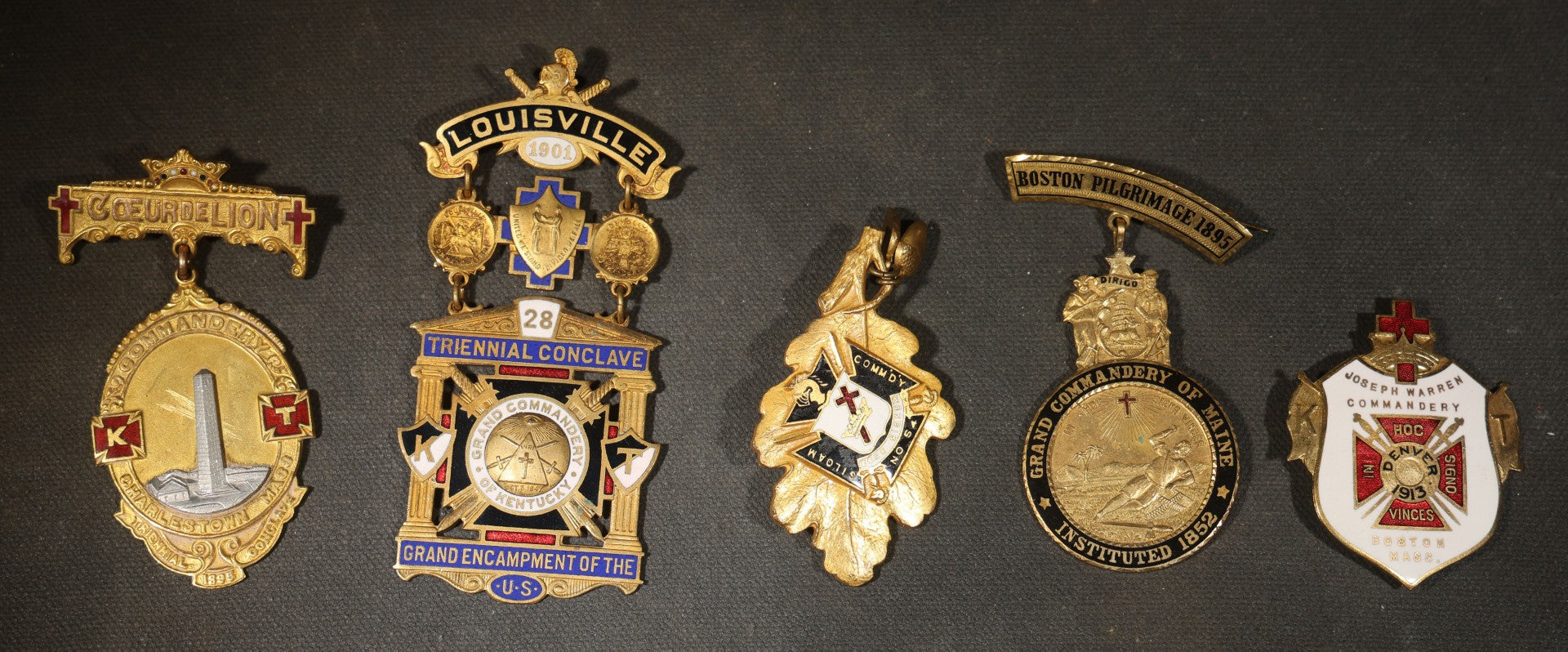 Grouping of Five Antique Knights Templar Medals and Badges including Joseph Warren Commandery Denver 1913, Grand Commandery of Maine 1895, Coeur de Lion Commandery Charlestown 1895, and 28th Triennial Conclave Louisville 1901