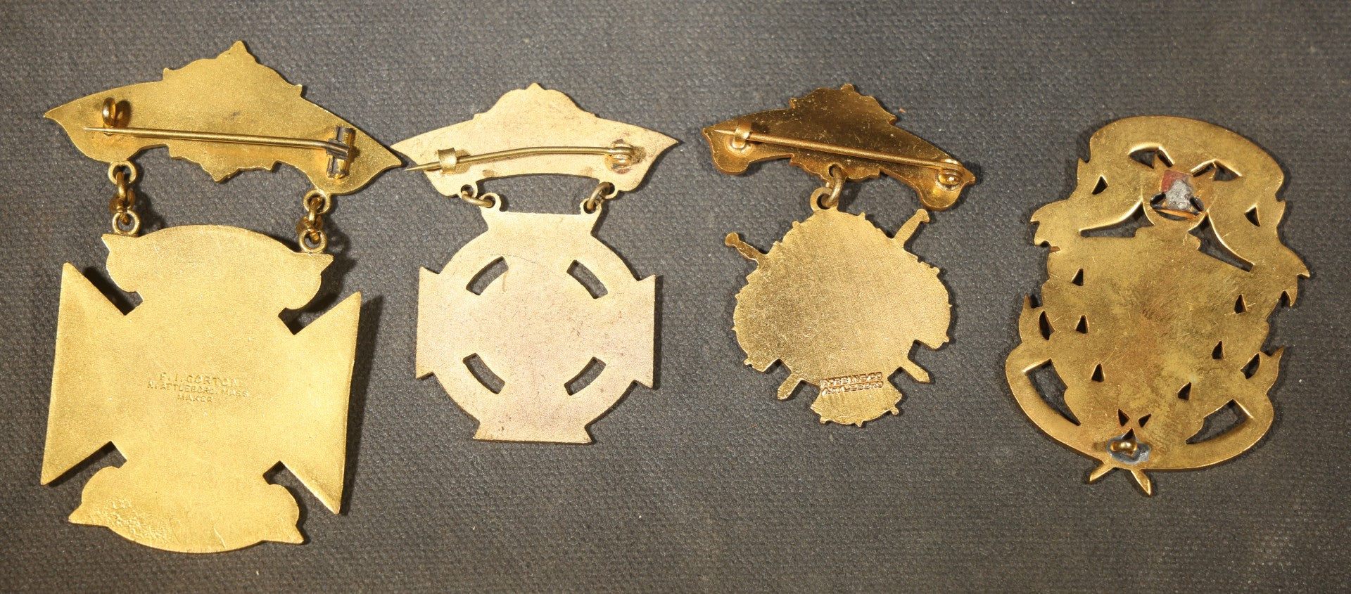 Grouping of Four Antique Knights Templar Enameled Badges and Medals Including Belvidere No. 2, Joseph Warren Commandery No. 26 Boston 35th Triennial Conclave 1922, and Hugh De Payens Commandery Melrose, Massachusetts