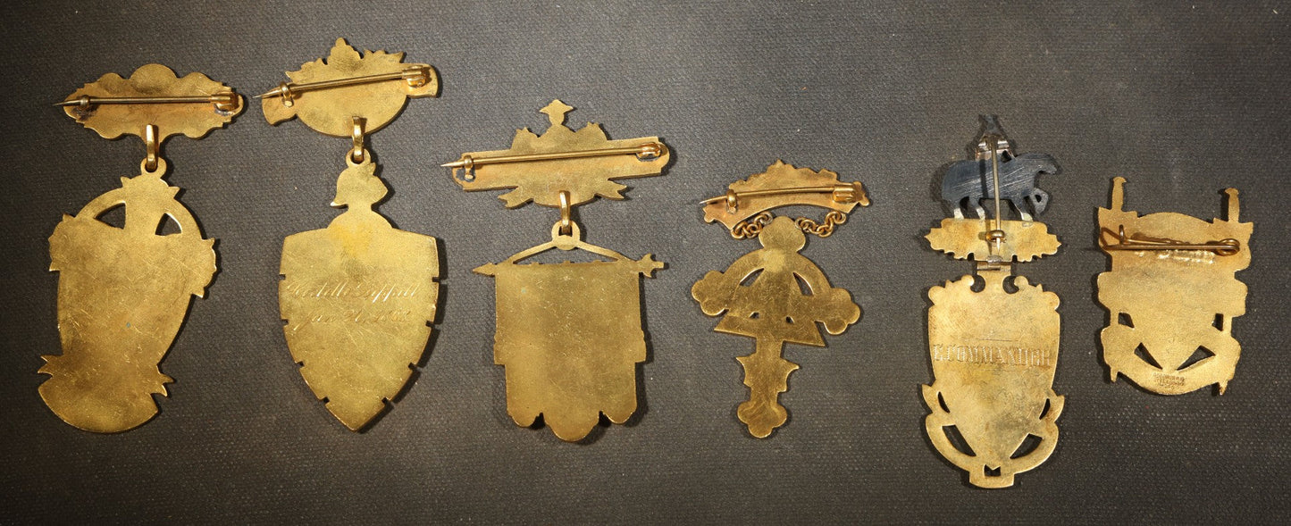 Grouping of Five Antique Knights Templar Enameled Badges Including Joseph Warren Commandery Boston 1919, Palestine Commandery Trenton, Columbian Commandery Norwich 1853, 23rd Triennial Conclave St. Louis 1886, and St. Johns No. 1 Providence, RI