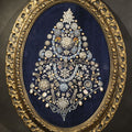 Lot 148 - Vintage Framed Costume Jewelry Christmas Tree Art in Oval Faux-Wood Frame, Rhinestone Brooches and Beads on Blue Velvet, 18" W x 23-1/2" H