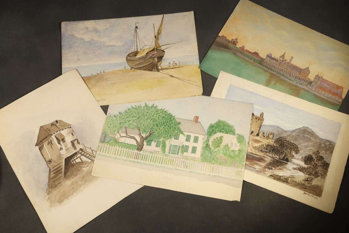 Grouping of Five Antique Watercolor Paintings on Paper including Beached Sailing Vessel, Castle Ruins, and New England House with Picket Fence, Two Dated 1883