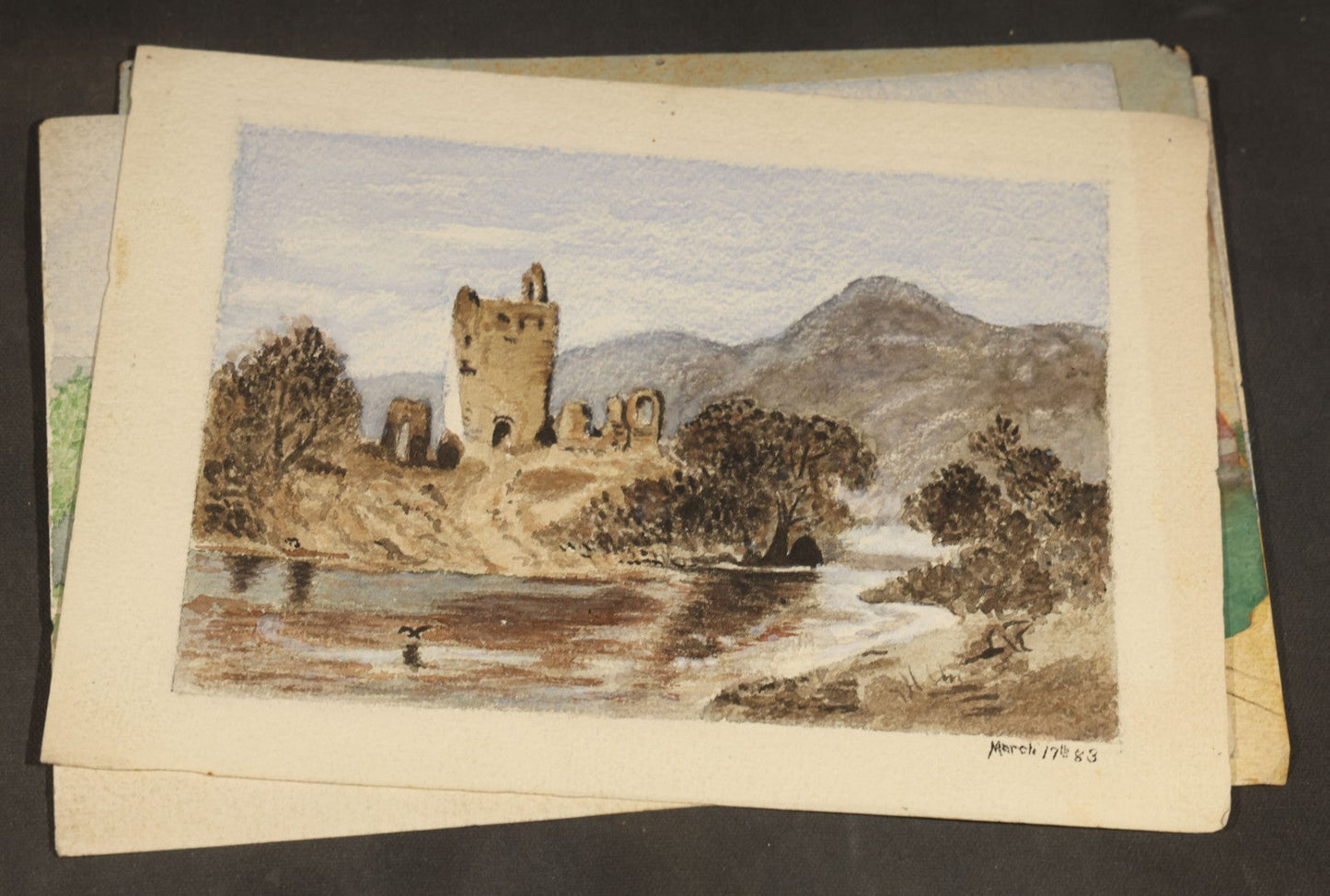 Grouping of Five Antique Watercolor Paintings on Paper including Beached Sailing Vessel, Castle Ruins, and New England House with Picket Fence, Two Dated 1883