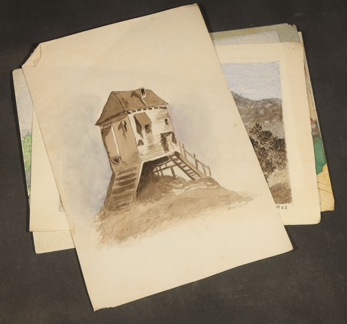 Grouping of Five Antique Watercolor Paintings on Paper including Beached Sailing Vessel, Castle Ruins, and New England House with Picket Fence, Two Dated 1883