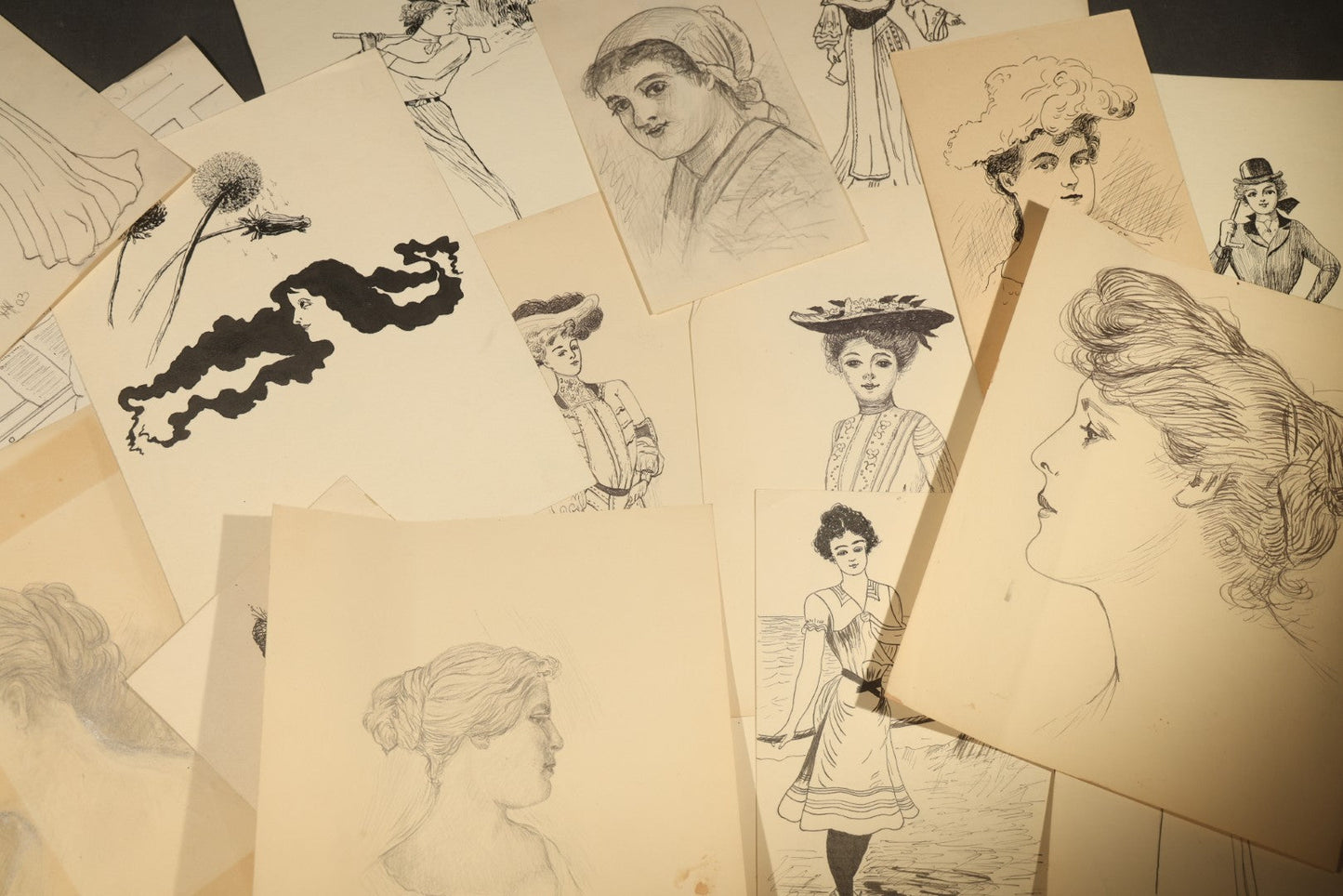 Grouping of 21 Antique Pen and Pencil Drawings on Paper of Women in Fashion, including Portraits, Seaside Bather, and Full-Figure Studies, One Dated June 1901
