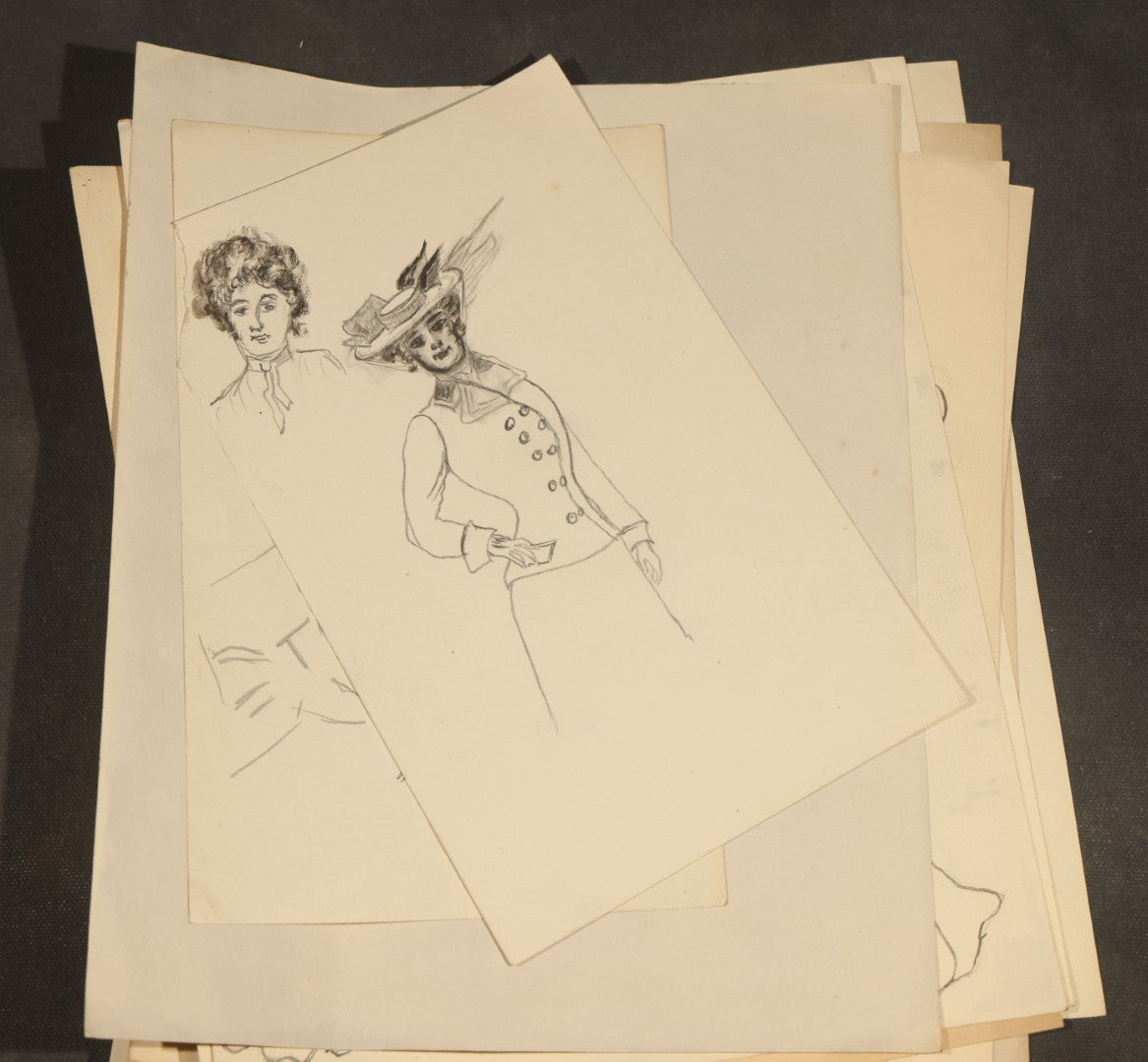 Grouping of 21 Antique Pen and Pencil Drawings on Paper of Women in Fashion, including Portraits, Seaside Bather, and Full-Figure Studies, One Dated June 1901