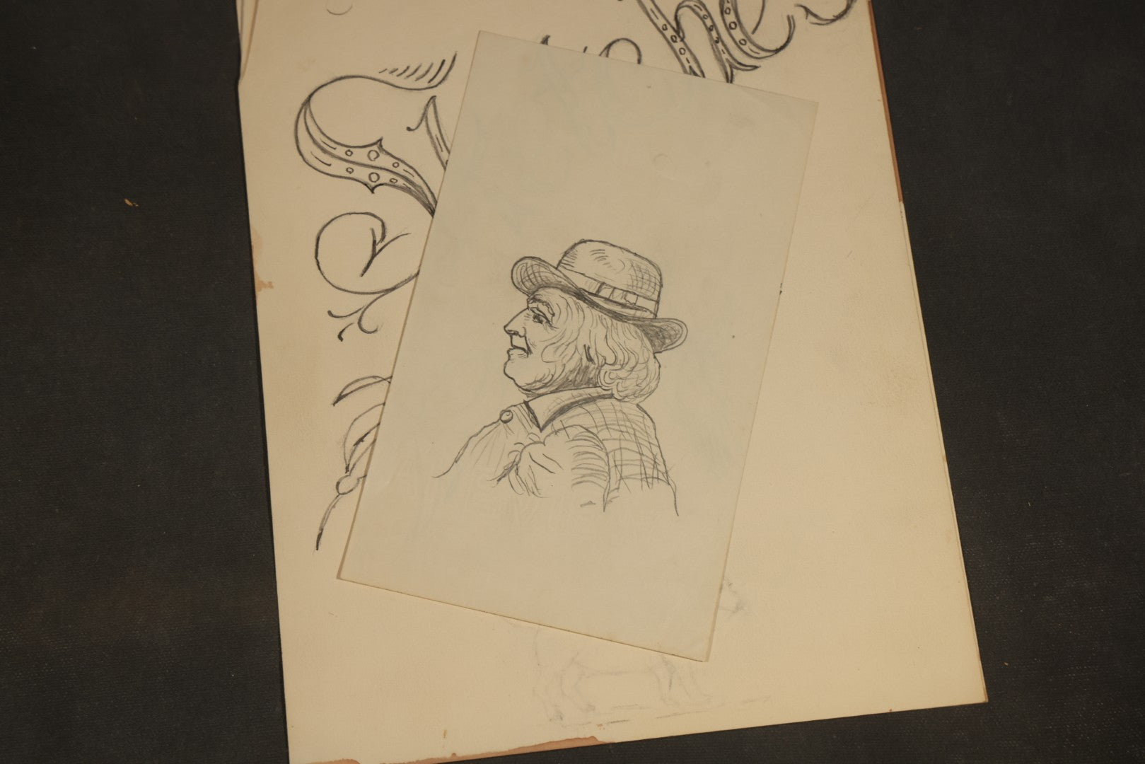 Grouping of 20 Antique Pen and Pencil Sketches including Portraits, Coastal Scene, Goat, Flowers, and "An Old Salt" Pipe Smoker, with Decorative "Sketches" Cover Sheet
