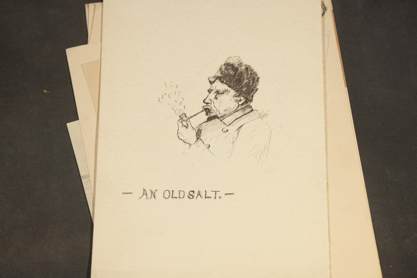 Grouping of 20 Antique Pen and Pencil Sketches including Portraits, Coastal Scene, Goat, Flowers, and "An Old Salt" Pipe Smoker, with Decorative "Sketches" Cover Sheet