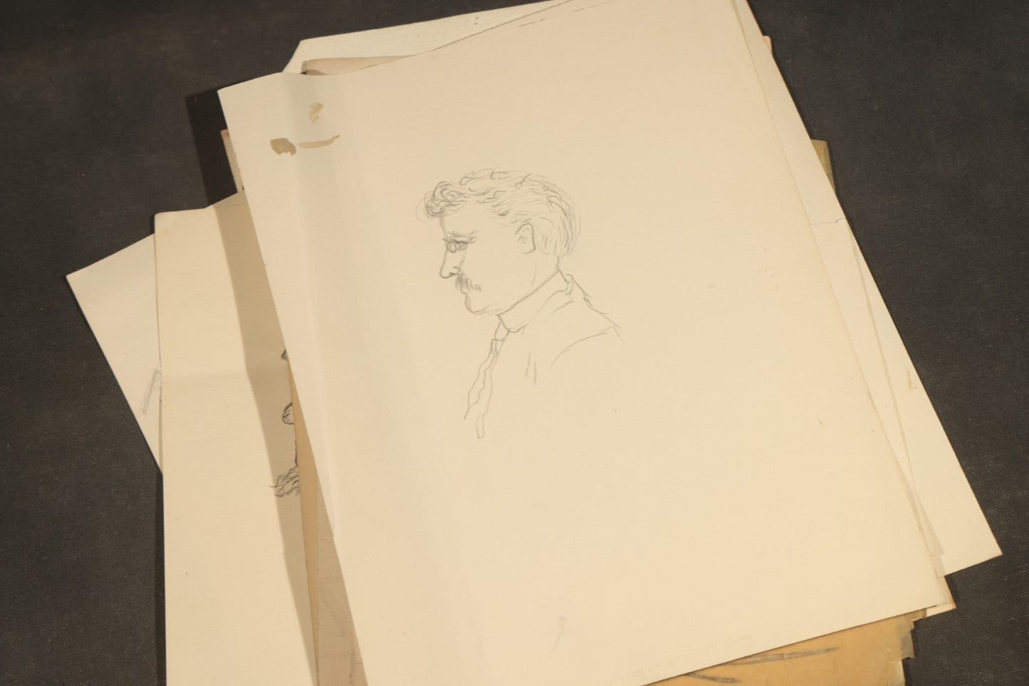 Grouping of 20 Antique Pen and Pencil Sketches including Portraits, Coastal Scene, Goat, Flowers, and "An Old Salt" Pipe Smoker, with Decorative "Sketches" Cover Sheet