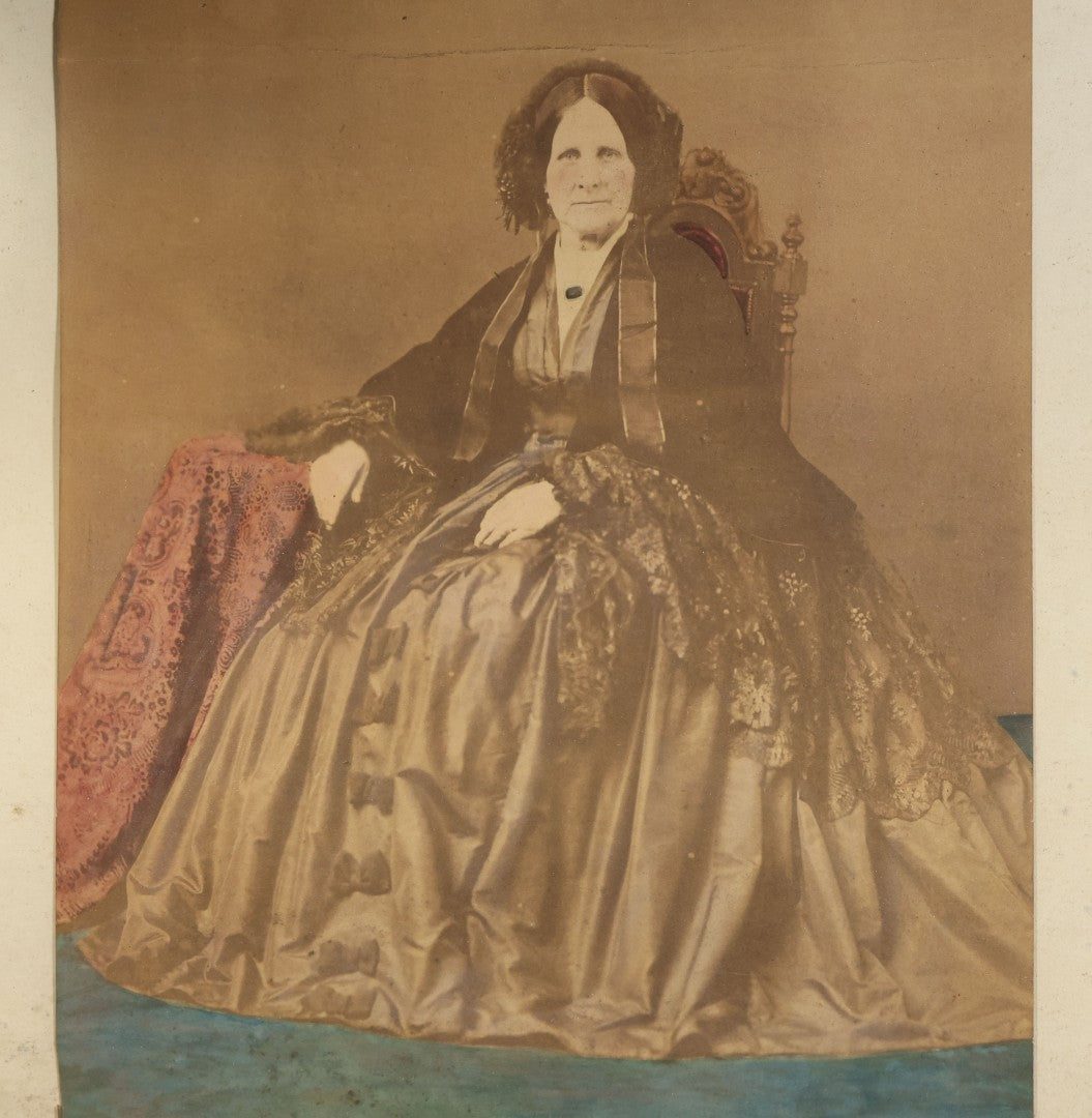 Antique Framed Hand-Colored Photograph of a Seated Elderly Woman in Hoop Skirt Dress