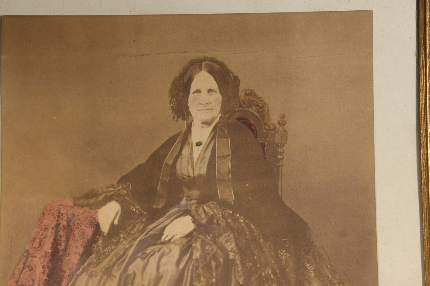 Antique Framed Hand-Colored Photograph of a Seated Elderly Woman in Hoop Skirt Dress