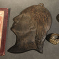 Lot 175 - Grouping of Five Vintage and Antique Smalls Including Cast Metal Washington Profile Plaque, Art Nouveau Miniature Needle Book, Wyeth Eye Wash Cobalt Blue Glass Stopper, and Two Ornate Costume Rings