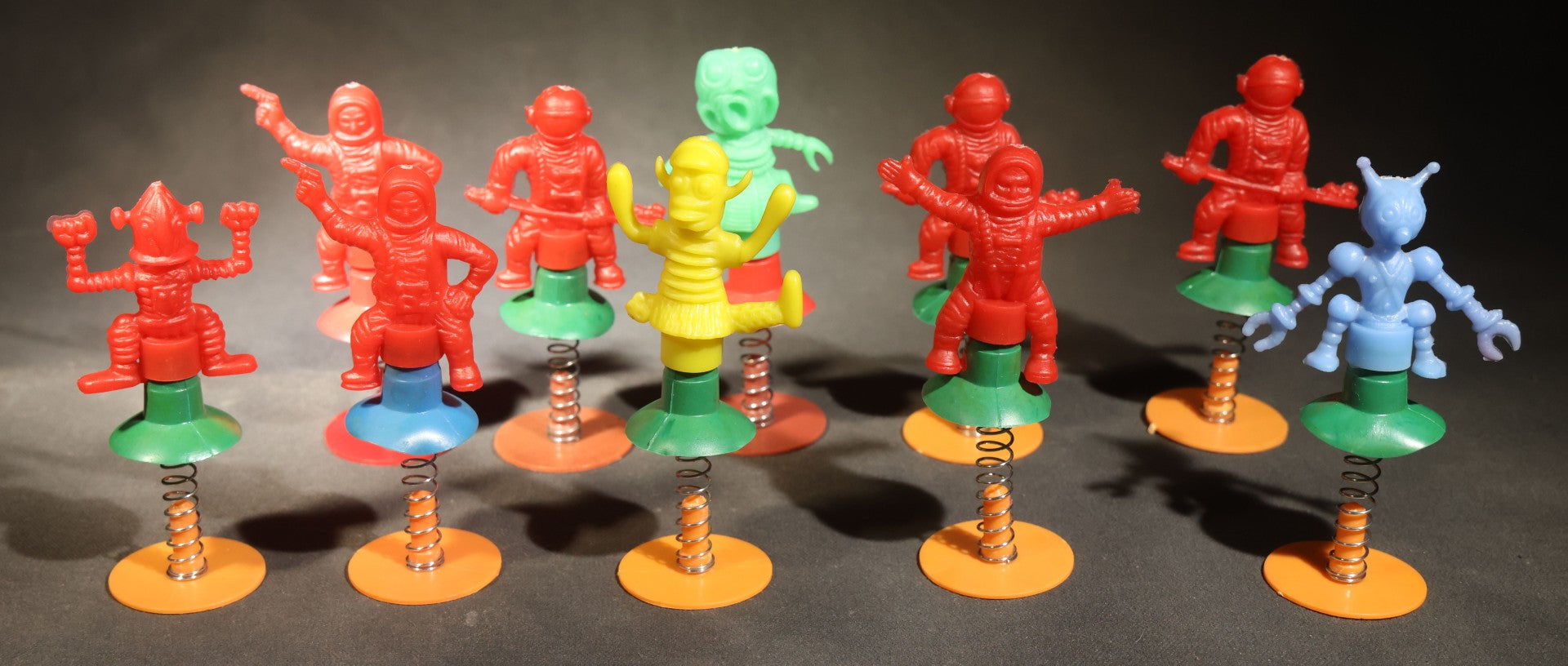 Grouping of 10 Vintage Plastic Space-Themed Jump-Up Spring Toys including Astronauts, Aliens, and Robot, H.F., Made in Hong Kong