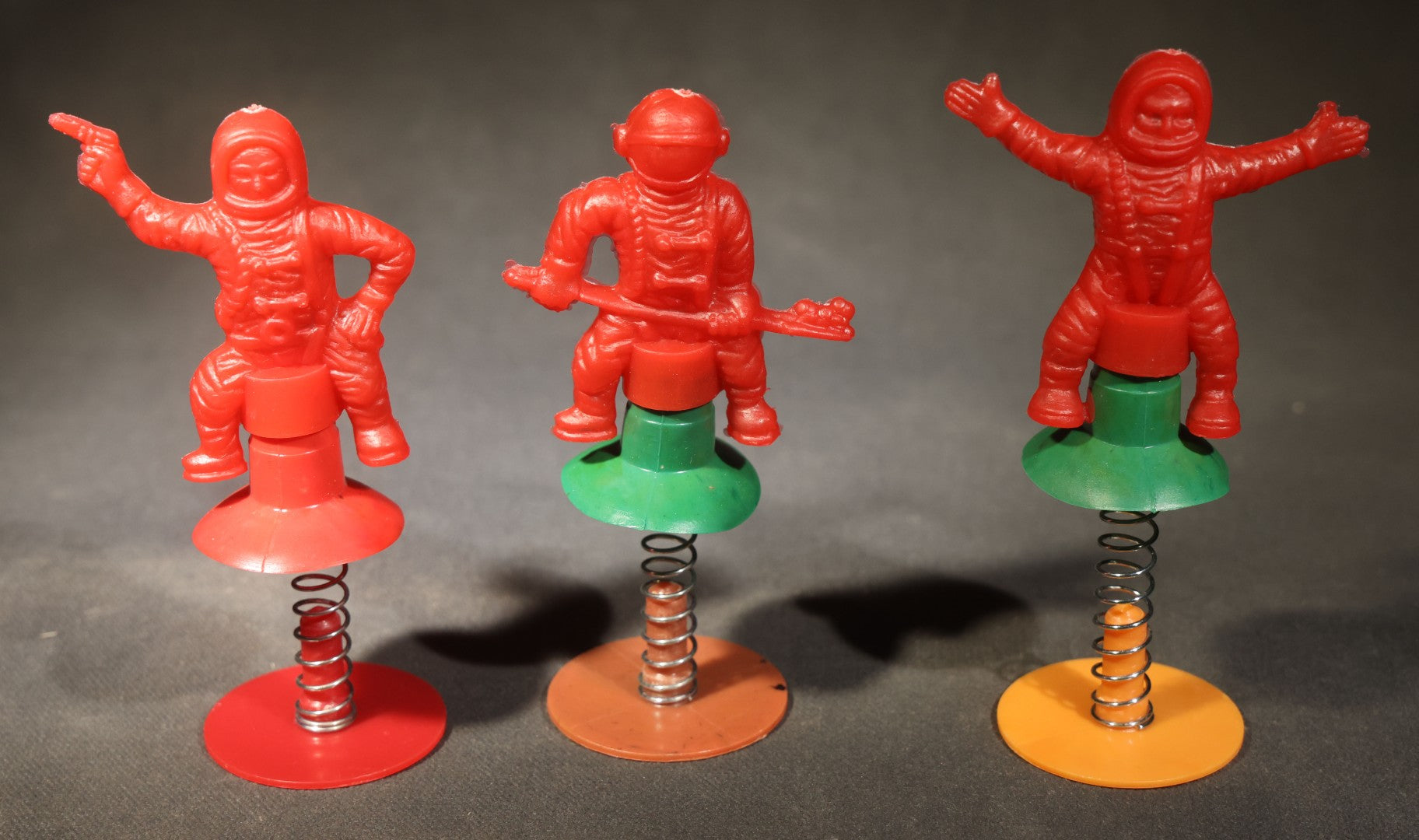 Grouping of 10 Vintage Plastic Space-Themed Jump-Up Spring Toys including Astronauts, Aliens, and Robot, H.F., Made in Hong Kong