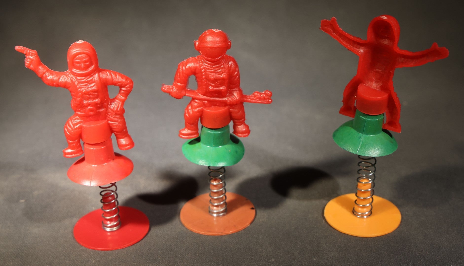 Grouping of 10 Vintage Plastic Space-Themed Jump-Up Spring Toys including Astronauts, Aliens, and Robot, H.F., Made in Hong Kong
