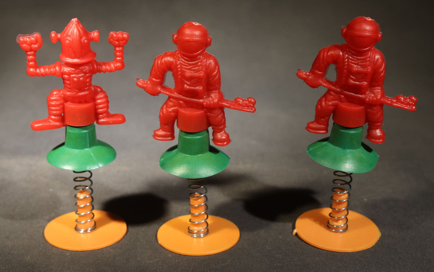 Grouping of 10 Vintage Plastic Space-Themed Jump-Up Spring Toys including Astronauts, Aliens, and Robot, H.F., Made in Hong Kong
