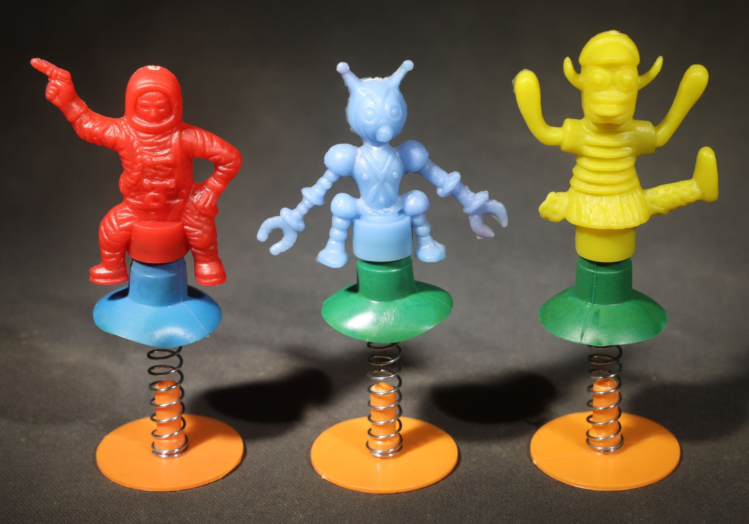 Grouping of 10 Vintage Plastic Space-Themed Jump-Up Spring Toys including Astronauts, Aliens, and Robot, H.F., Made in Hong Kong