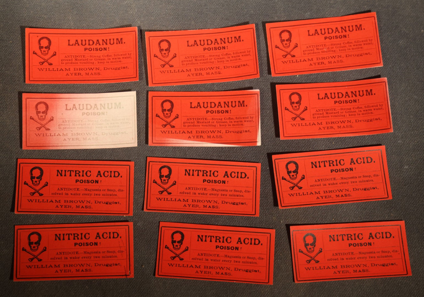 Grouping of 12 Antique Unused Poison Labels with Skull and Crossbones including Laudanum and Nitric Acid, William Brown, Druggist, Ayer, Massachusetts