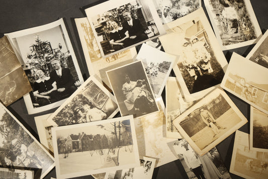 Grouping of 25+ Antique and Vintage Snapshot Photographs including Christmas Tree Portraits, Children with Dogs, Residential Architecture, and Family Scenes