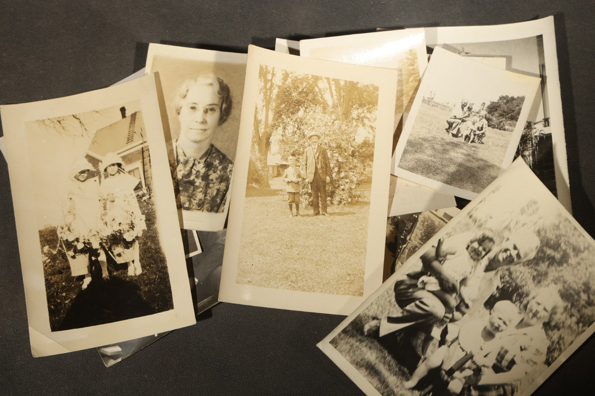 Grouping of 25+ Antique and Vintage Snapshot Photographs including Christmas Tree Portraits, Children with Dogs, Residential Architecture, and Family Scenes