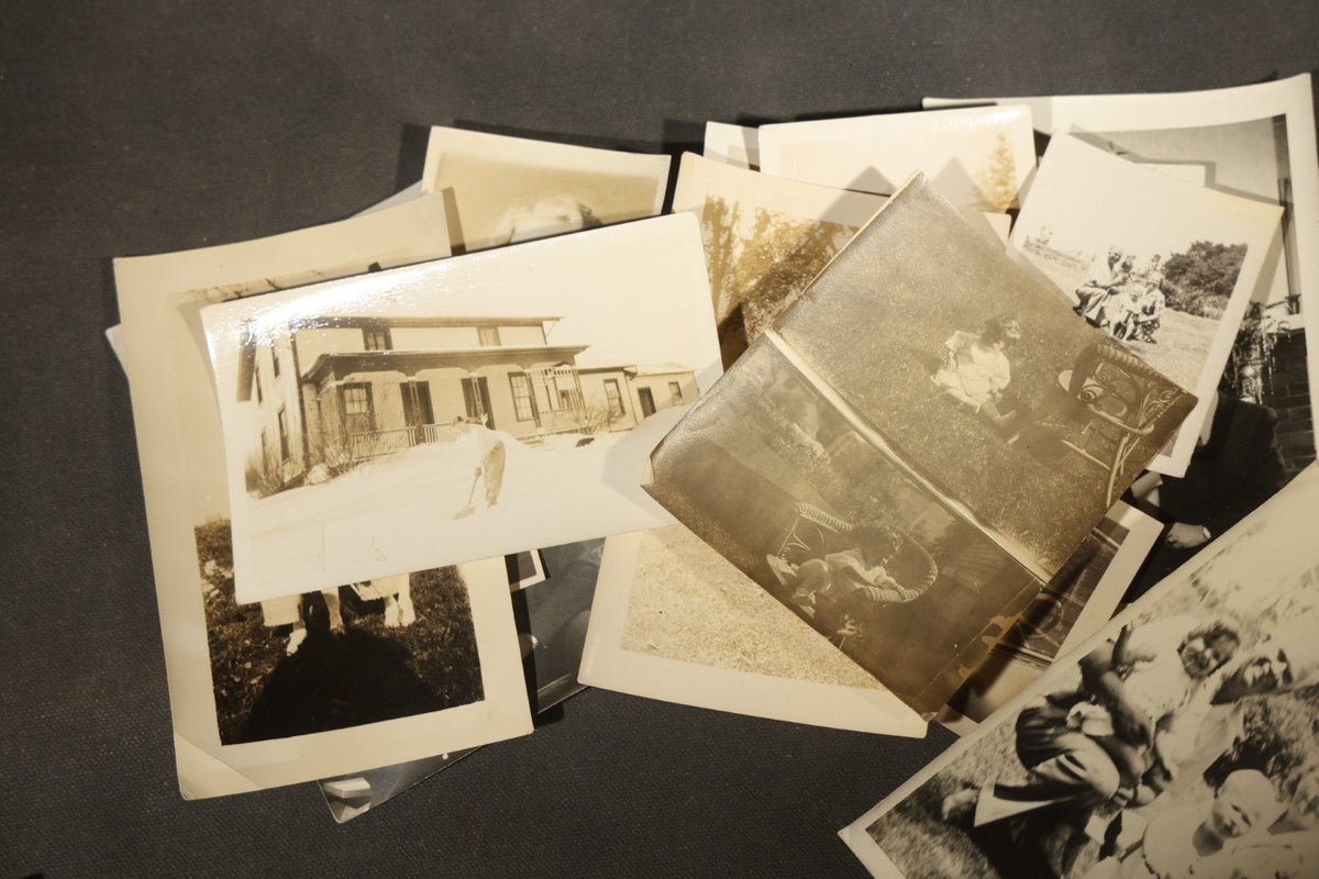 Grouping of 25+ Antique and Vintage Snapshot Photographs including Christmas Tree Portraits, Children with Dogs, Residential Architecture, and Family Scenes