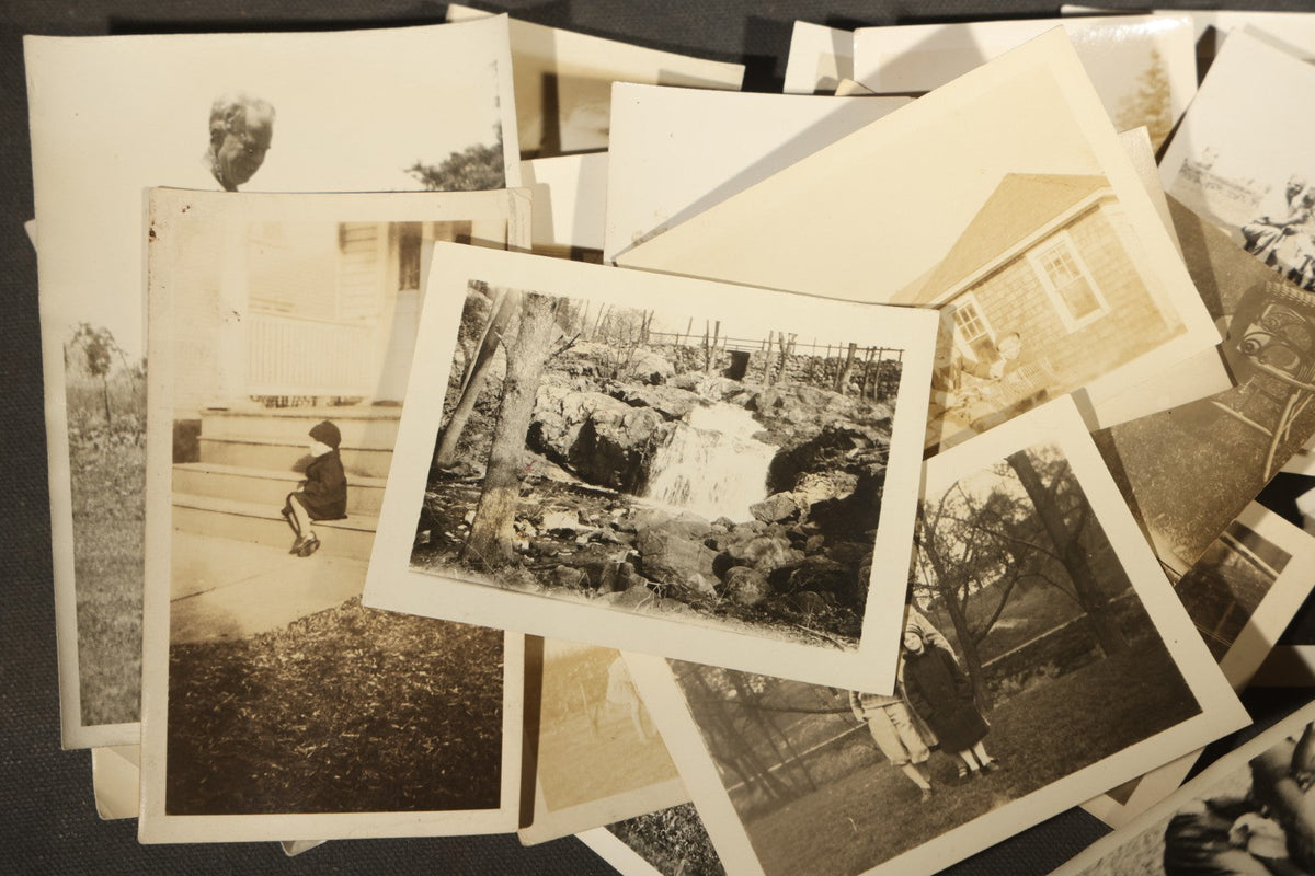 Grouping of 25+ Antique and Vintage Snapshot Photographs including Christmas Tree Portraits, Children with Dogs, Residential Architecture, and Family Scenes