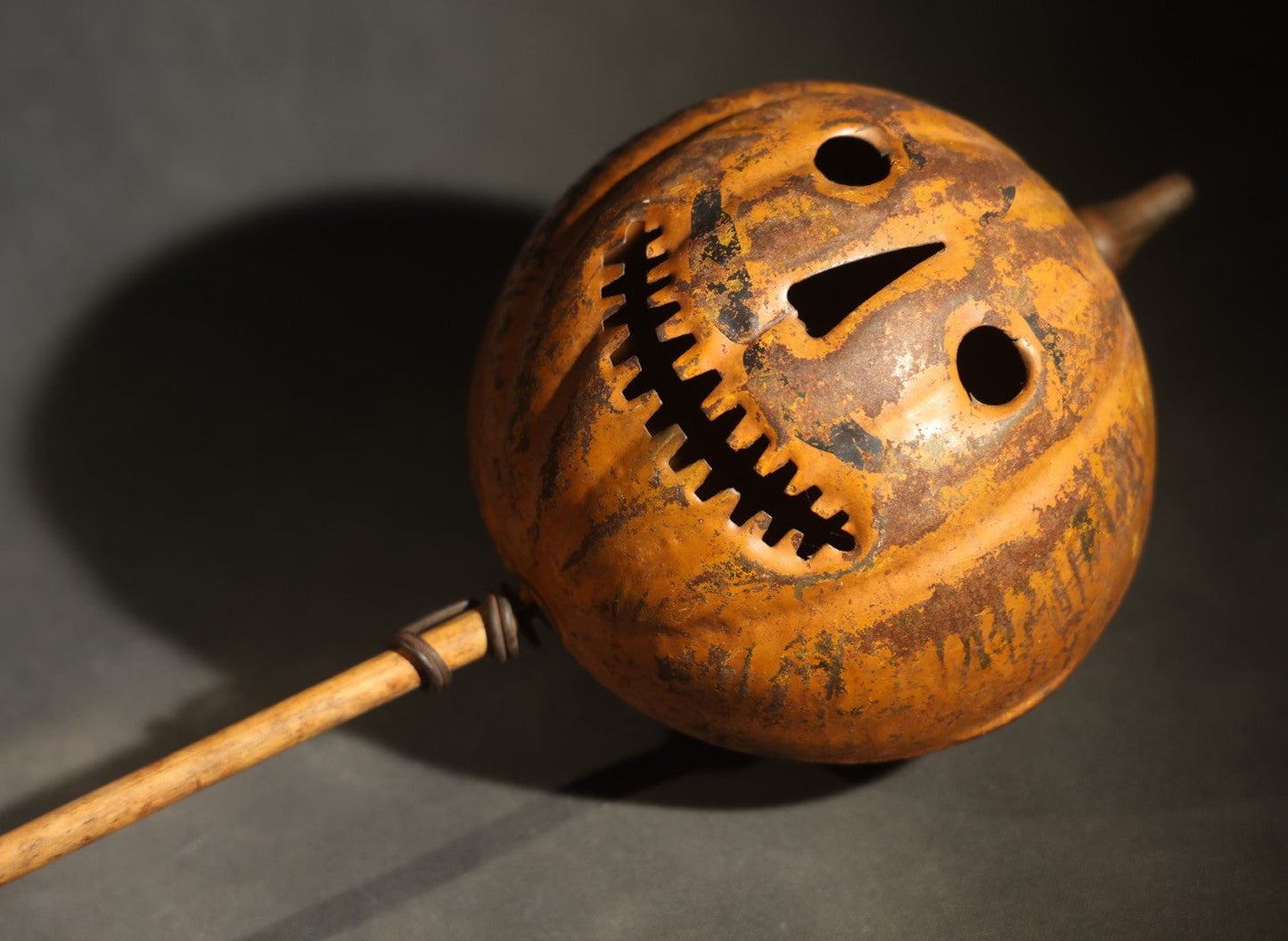 Antique Pressed Tin Halloween Jack-O-Lantern Pumpkin Parade Lantern on Bamboo Stick with Interior Candle Cup, Attributed to Toledo Metal Sign Company, Toledo, Ohio, Circa 1905-1910