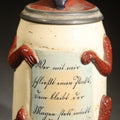 Lot 003 - Antique German Figural Devil Beer Stein with Pewter Rimmed Lid, "Wer Mit Mir Schließt Einen Pakt, Dem Bleibt Der Magen Stets Intakt" ("Whoever Makes a Pact with Me, Their Stomach Will Always Remain Intact"), Mold 1565, 8-1/2" H