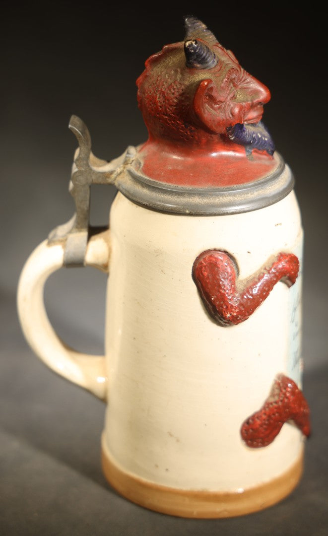 Antique German Figural Devil Beer Stein with Pewter Rimmed Lid, "Wer mit mir schließt einen Pakt, dem bleibt der Magen stets intakt" ("Whoever Makes a Pact with Me, Their Stomach Will Always Remain Intact"), Mold 1565