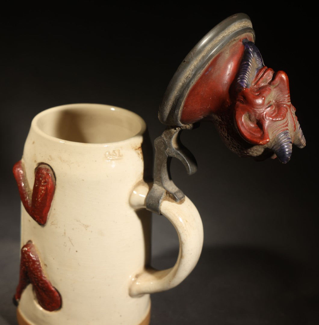 Antique German Figural Devil Beer Stein with Pewter Rimmed Lid, "Wer mit mir schließt einen Pakt, dem bleibt der Magen stets intakt" ("Whoever Makes a Pact with Me, Their Stomach Will Always Remain Intact"), Mold 1565