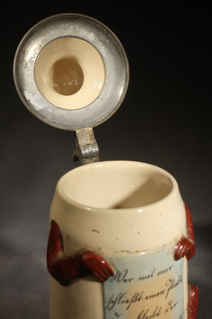 Antique German Figural Devil Beer Stein with Pewter Rimmed Lid, "Wer mit mir schließt einen Pakt, dem bleibt der Magen stets intakt" ("Whoever Makes a Pact with Me, Their Stomach Will Always Remain Intact"), Mold 1565