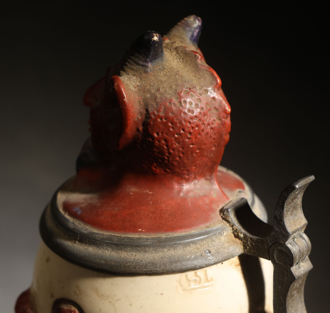 Antique German Figural Devil Beer Stein with Pewter Rimmed Lid, "Wer mit mir schließt einen Pakt, dem bleibt der Magen stets intakt" ("Whoever Makes a Pact with Me, Their Stomach Will Always Remain Intact"), Mold 1565