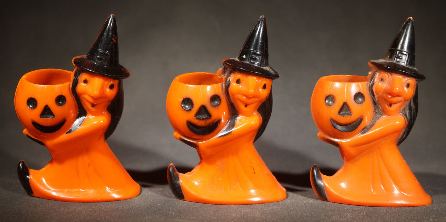 Trio of Vintage Plastic Halloween Witch Holding Jack-O-Lantern Candy Containers, Circa 1950s, Manufactured by Rosbro Plastics, Pawtucket, Rhode Island