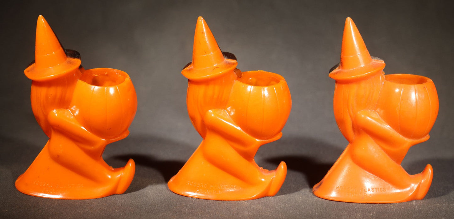 Trio of Vintage Plastic Halloween Witch Holding Jack-O-Lantern Candy Containers, Circa 1950s, Manufactured by Rosbro Plastics, Pawtucket, Rhode Island