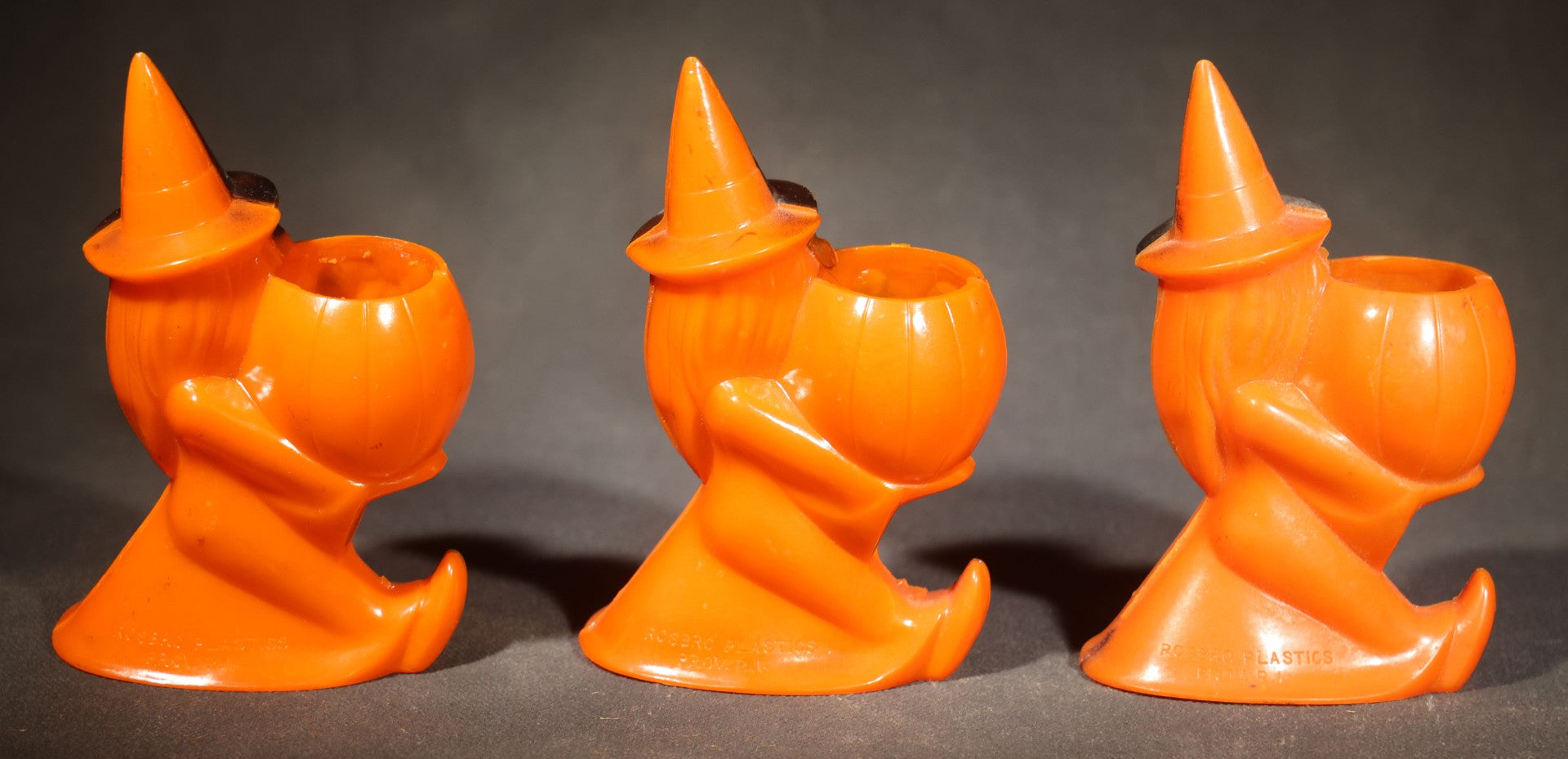 Trio of Vintage Plastic Halloween Witch Holding Jack-O-Lantern Candy Containers, Circa 1950s, Manufactured by Rosbro Plastics, Pawtucket, Rhode Island