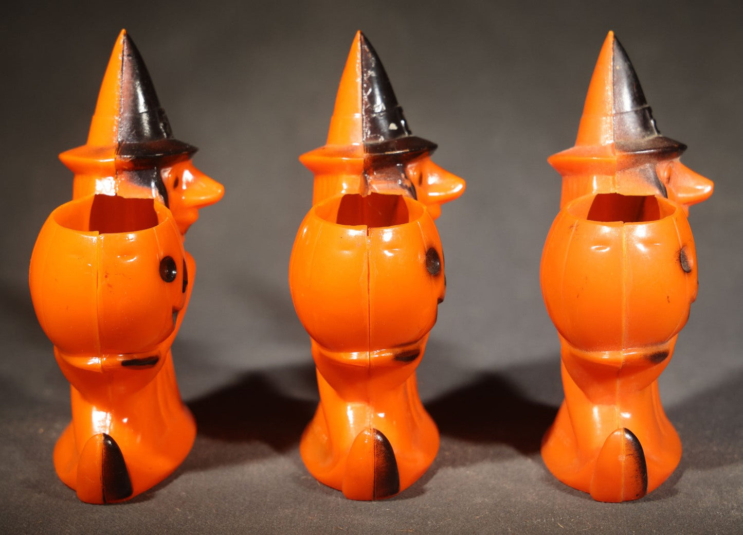 Trio of Vintage Plastic Halloween Witch Holding Jack-O-Lantern Candy Containers, Circa 1950s, Manufactured by Rosbro Plastics, Pawtucket, Rhode Island