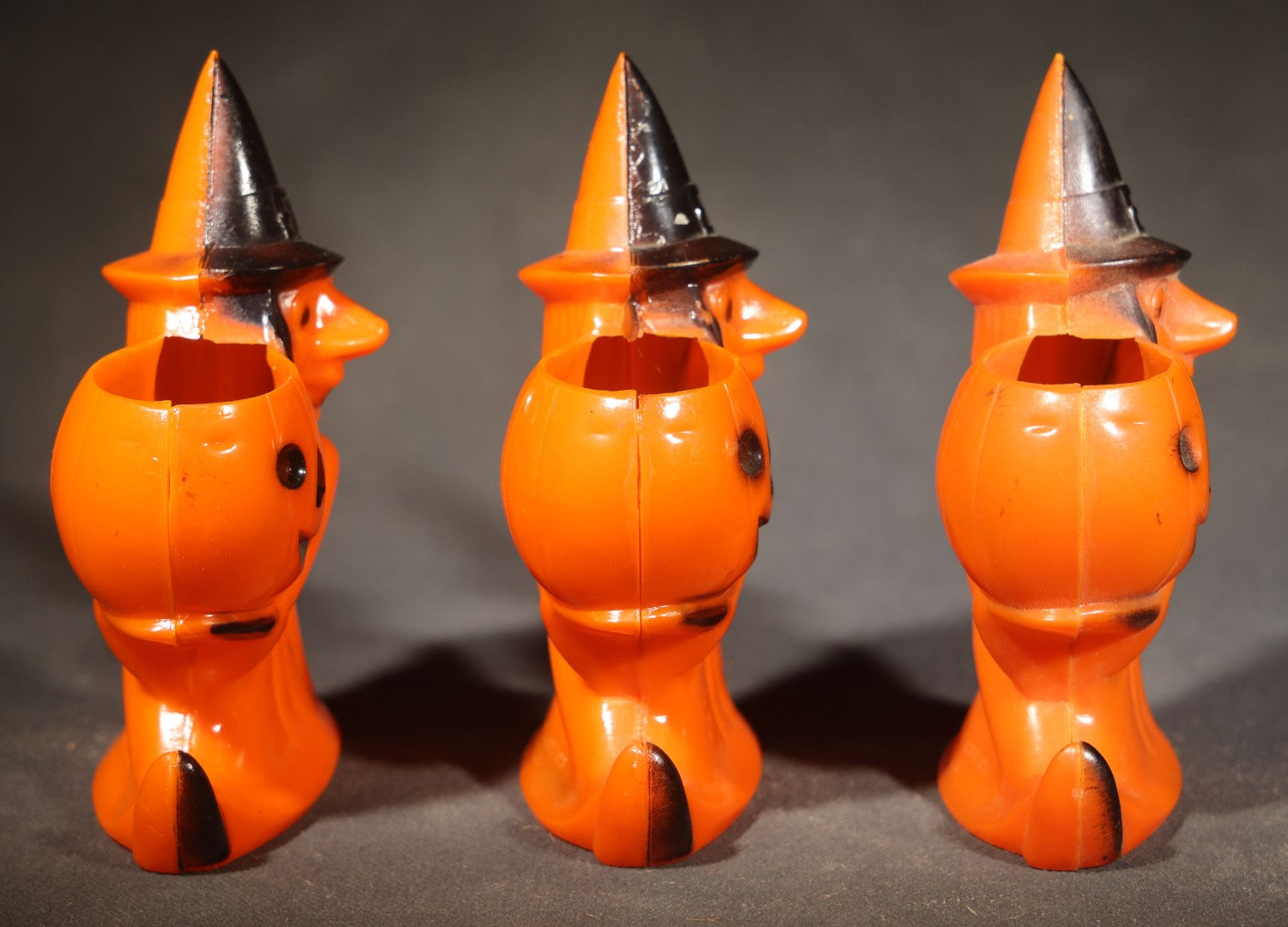 Trio of Vintage Plastic Halloween Witch Holding Jack-O-Lantern Candy Containers, Circa 1950s, Manufactured by Rosbro Plastics, Pawtucket, Rhode Island