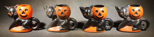 Grouping of Four Vintage Plastic Halloween Cat Holding Jack-O-Lantern Candy Containers, Circa 1950s, Manufactured by Rosbro Plastics, Pawtucket, Rhode Island