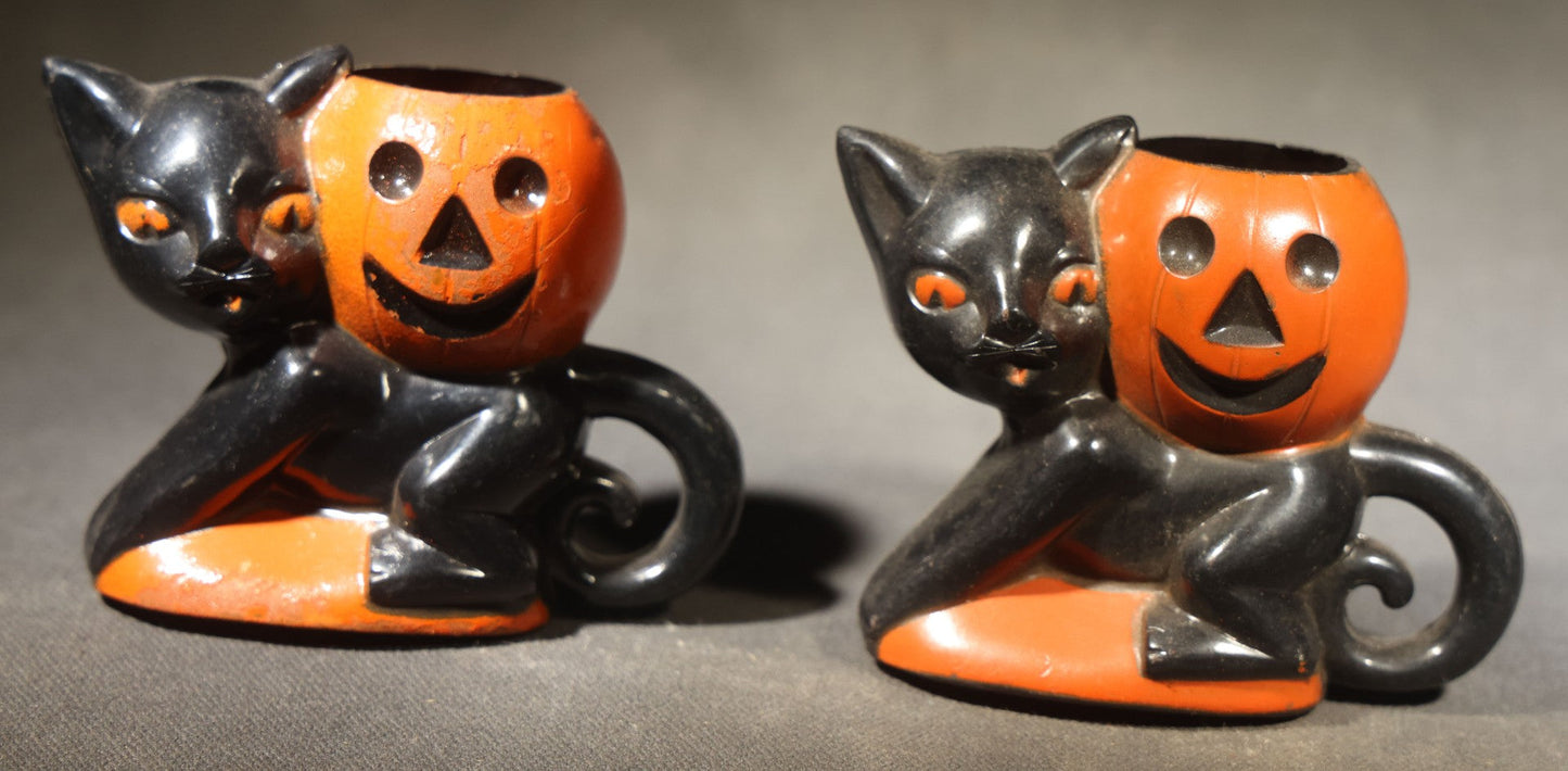 Grouping of Four Vintage Plastic Halloween Cat Holding Jack-O-Lantern Candy Containers, Circa 1950s, Manufactured by Rosbro Plastics, Pawtucket, Rhode Island