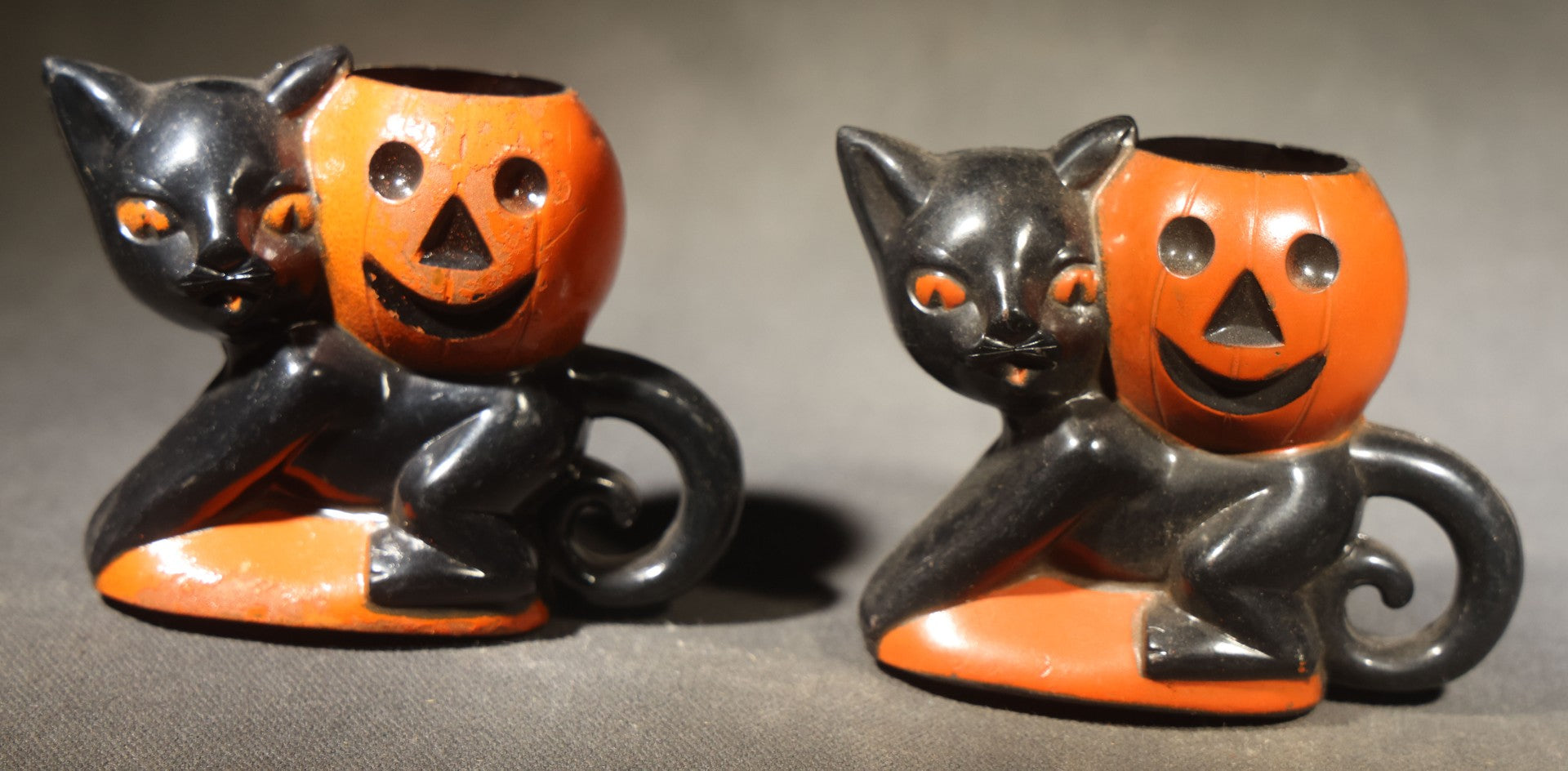 Grouping of Four Vintage Plastic Halloween Cat Holding Jack-O-Lantern Candy Containers, Circa 1950s, Manufactured by Rosbro Plastics, Pawtucket, Rhode Island