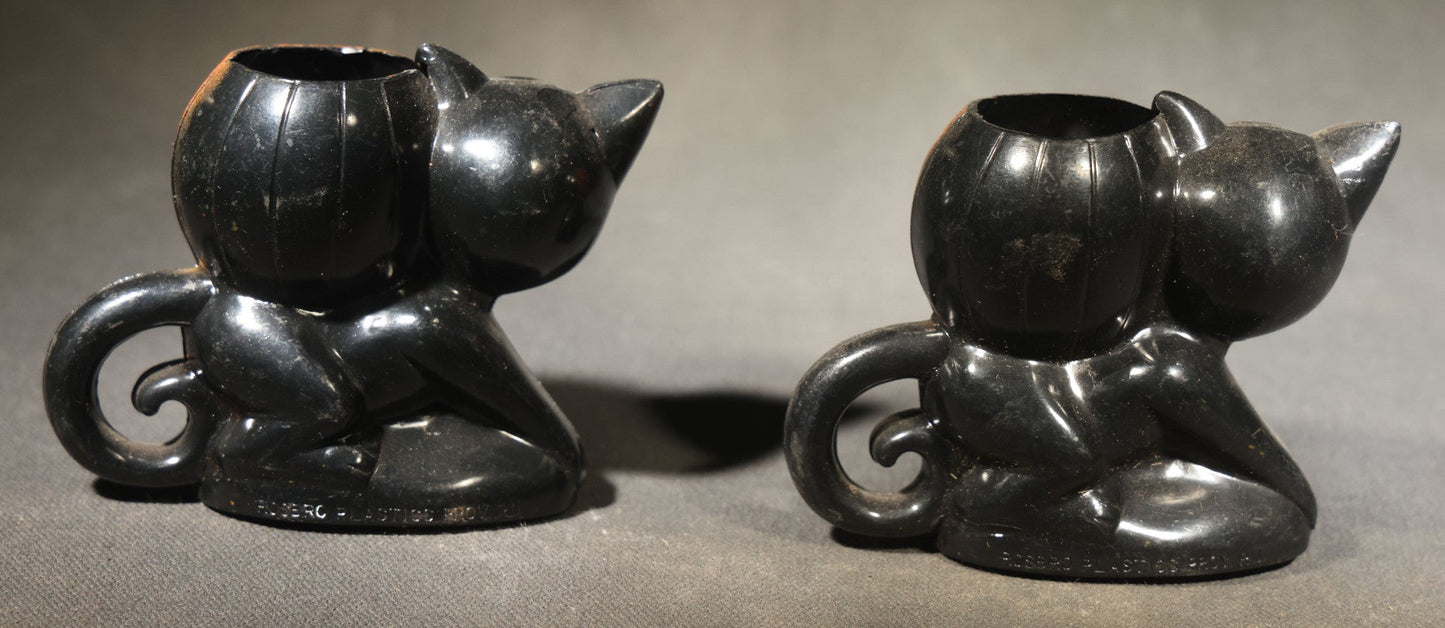 Grouping of Four Vintage Plastic Halloween Cat Holding Jack-O-Lantern Candy Containers, Circa 1950s, Manufactured by Rosbro Plastics, Pawtucket, Rhode Island