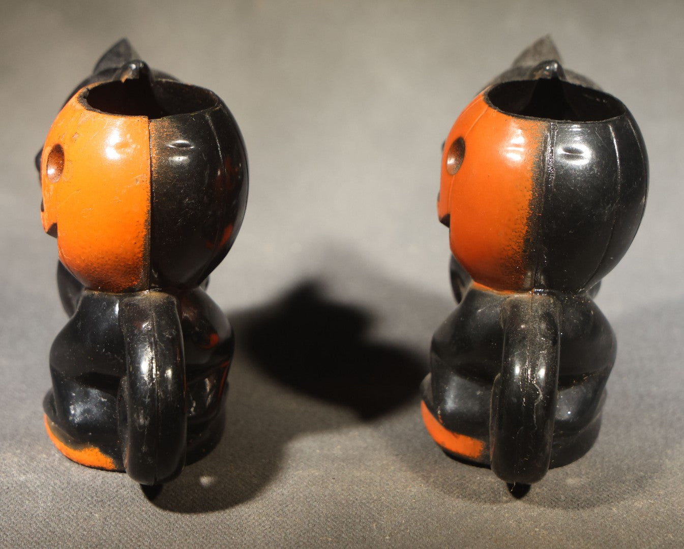 Grouping of Four Vintage Plastic Halloween Cat Holding Jack-O-Lantern Candy Containers, Circa 1950s, Manufactured by Rosbro Plastics, Pawtucket, Rhode Island