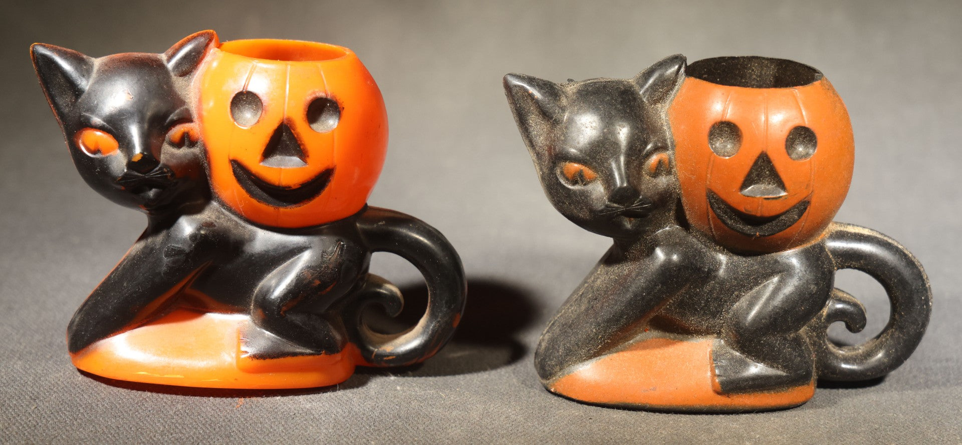 Grouping of Four Vintage Plastic Halloween Cat Holding Jack-O-Lantern Candy Containers, Circa 1950s, Manufactured by Rosbro Plastics, Pawtucket, Rhode Island