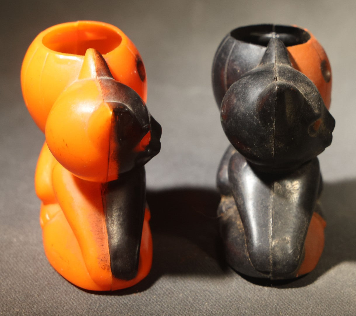 Grouping of Four Vintage Plastic Halloween Cat Holding Jack-O-Lantern Candy Containers, Circa 1950s, Manufactured by Rosbro Plastics, Pawtucket, Rhode Island