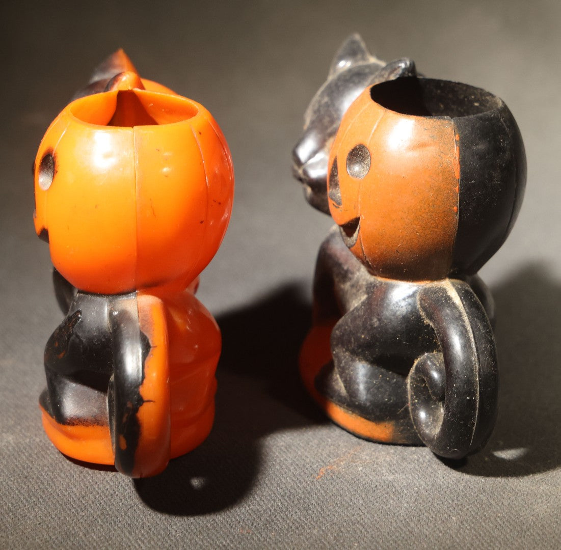 Grouping of Four Vintage Plastic Halloween Cat Holding Jack-O-Lantern Candy Containers, Circa 1950s, Manufactured by Rosbro Plastics, Pawtucket, Rhode Island