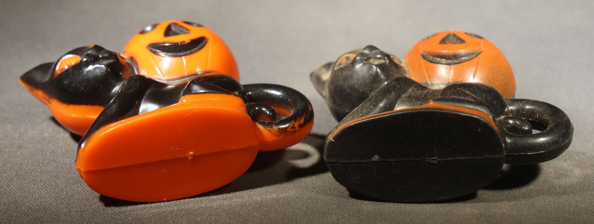 Grouping of Four Vintage Plastic Halloween Cat Holding Jack-O-Lantern Candy Containers, Circa 1950s, Manufactured by Rosbro Plastics, Pawtucket, Rhode Island