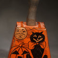 Lot 033 - Vintage Halloween Tin Lithograph Bell Noisemaker with Jack-O-Lantern, Black Cat, Man in the Moon, Witch on Broomstick, Bats, and Town Silhouette, 5-3/4" H