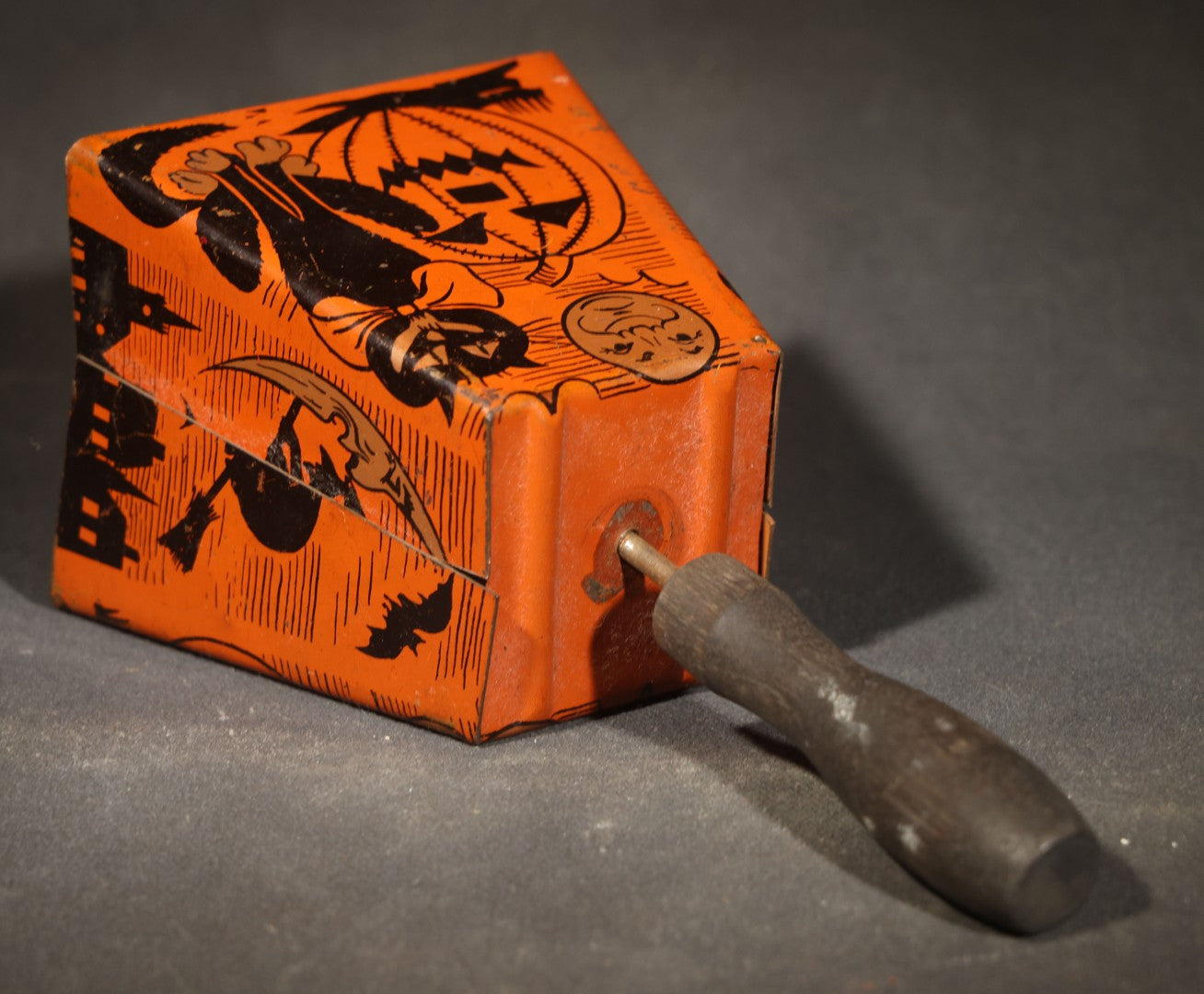 Vintage Halloween Tin Lithograph Bell Noisemaker with Jack-O-Lantern, Black Cat, Man in the Moon, Witch on Broomstick, Bats, and Town Silhouette