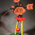 Lot 034 - Vintage Painted Wooden Halloween Balancing Witch on Broomstick with Wire and Ball Counterweight, Circa 1990s, 10" H